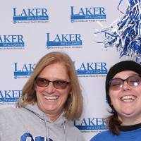 Mother and daughter posing together